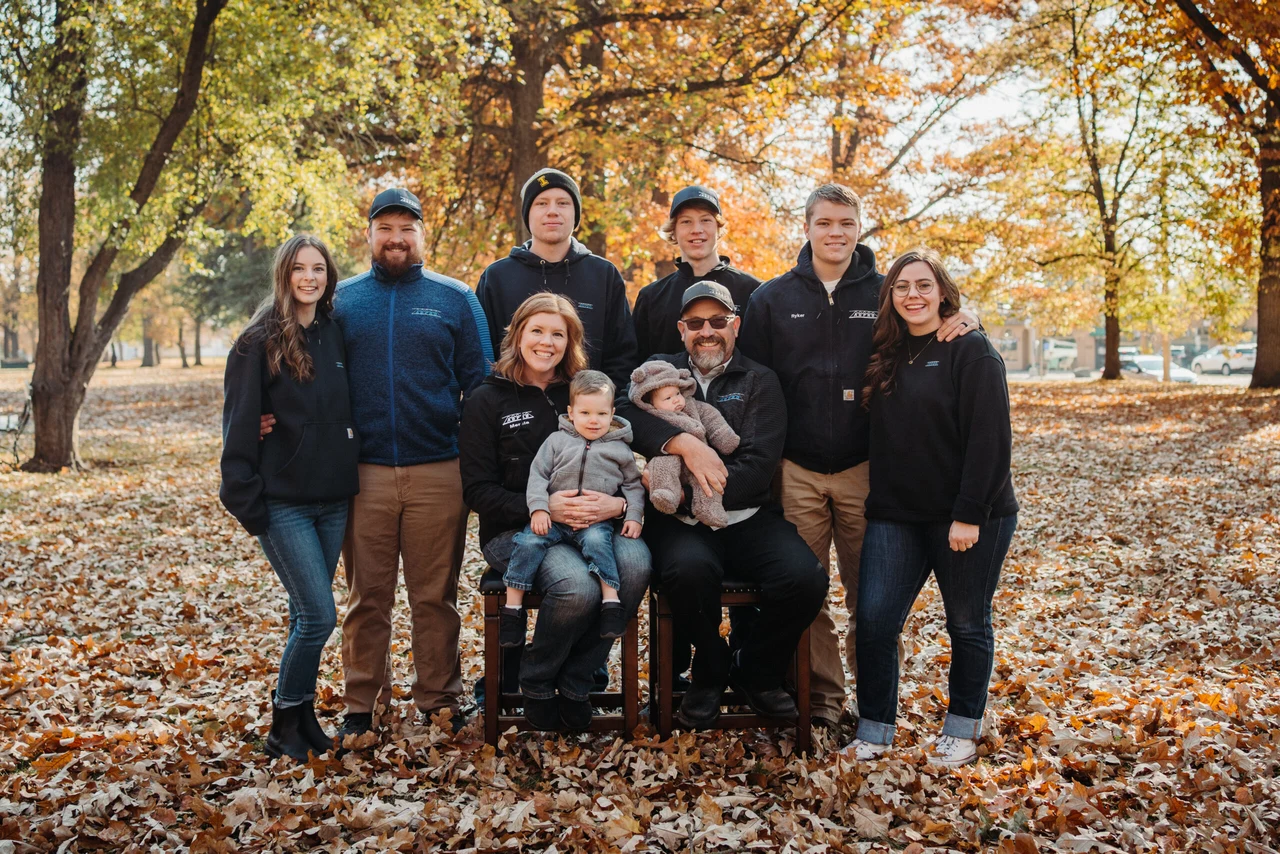 Blake and Mercia Neace with their family outdoors in autumn Blake and Mercia Neace with their family outdoors in autumn